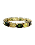 Alliance américaine en vermeil sertie d’opales jaunes et de tourmalines vertes ovales en serti griffe, bijou coloré et moderne alliant élégance et originalité.