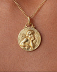 Médaille de baptême en or jaune 18 carat représentant un angelot