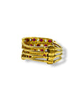 Bague turque à quatre anneaux mobiles en or jaune 18 carats, un bijou de tradition orientale serti de rubis et de diamants.