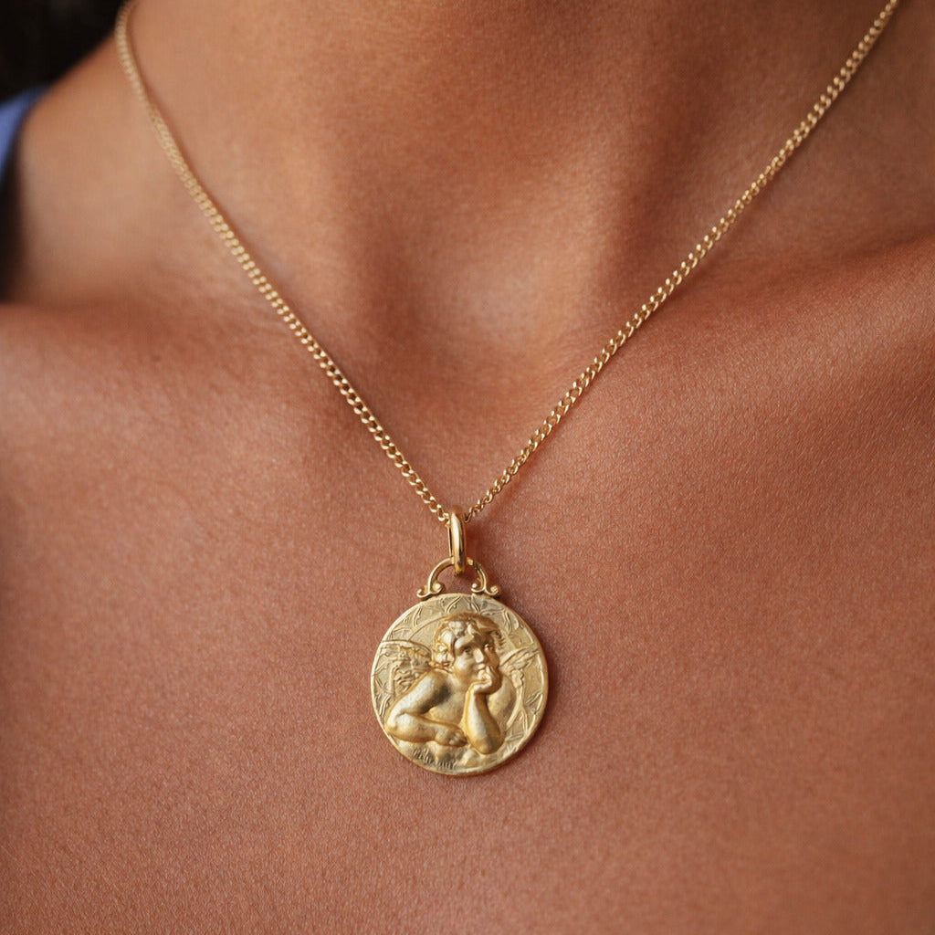 Médaille de baptême en or jaune 18 carat représentant un angelot 