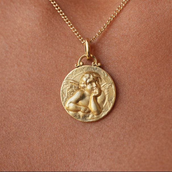 Médaille de baptême en or jaune 18 carat représentant un angelot 