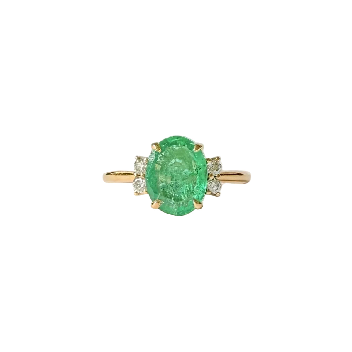 Bague émeraude ovale et quatre diamants sur une monture en or jaune 18 carats