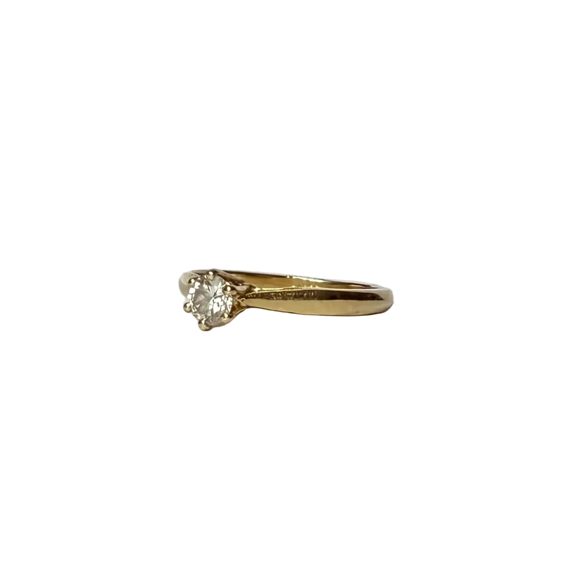 Bague solitaire en or jaune 18 carats ornée d'un diamant de 0,2 carats. 