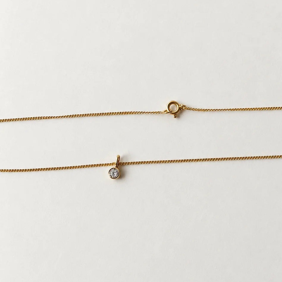 Collier en or jaune 18 carat orné d'un pendentif coulissant diamant de 0.1 carat
