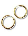 Paire de créoles en or jaune 18 carats fermoir à tiges.
