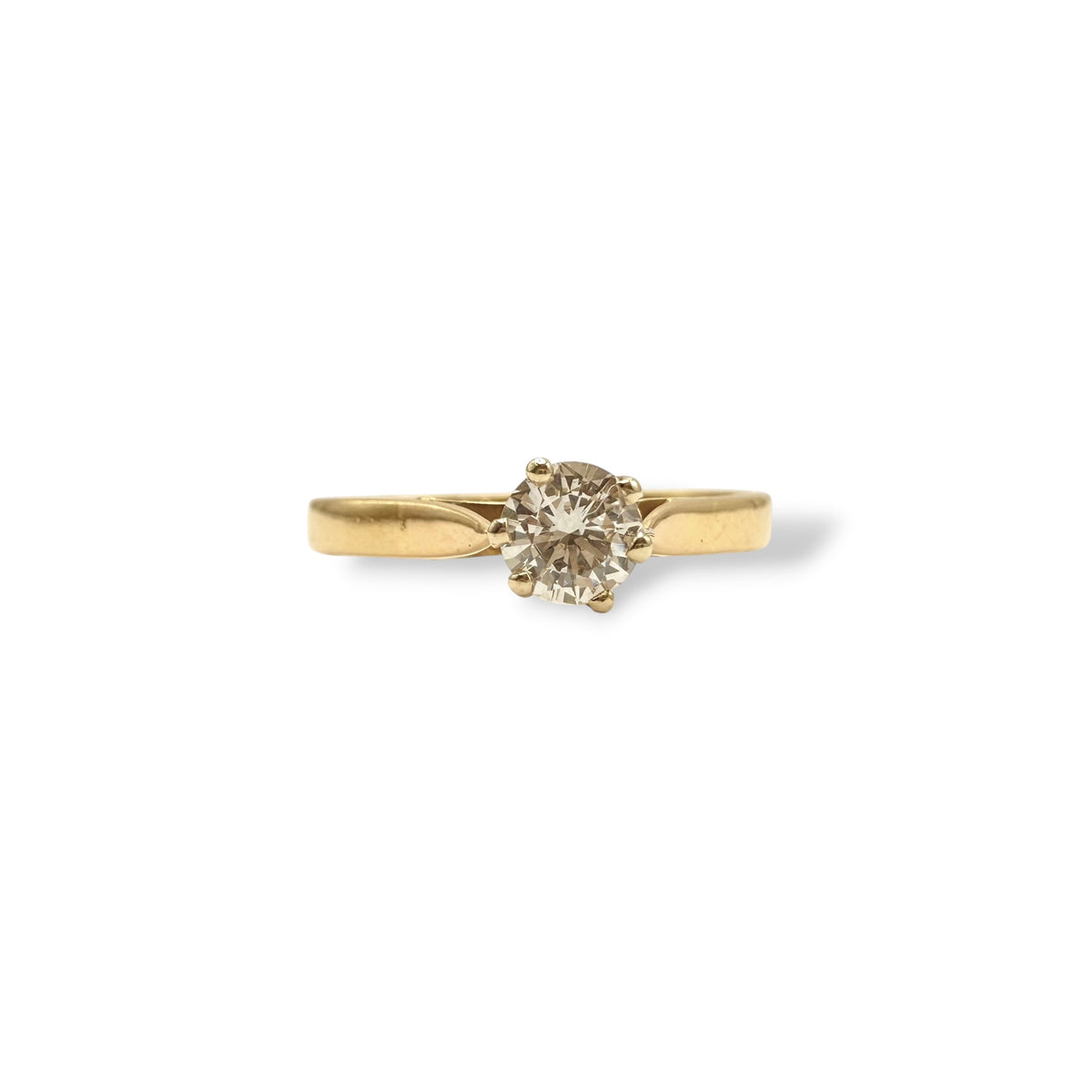 Bague solitaire en or jaune 18 carats avec diamant taille brillant de 0,20 carat monté sur griffes, modèle français vers 1990.